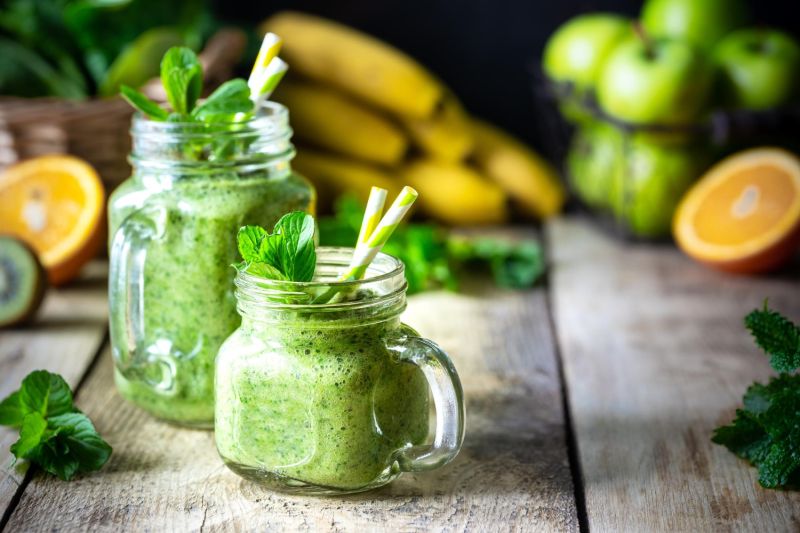 a green smoothie in a glass jar